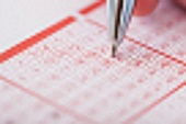 bigstock-Person-Holding-Pen-Over-Lotter-64666177